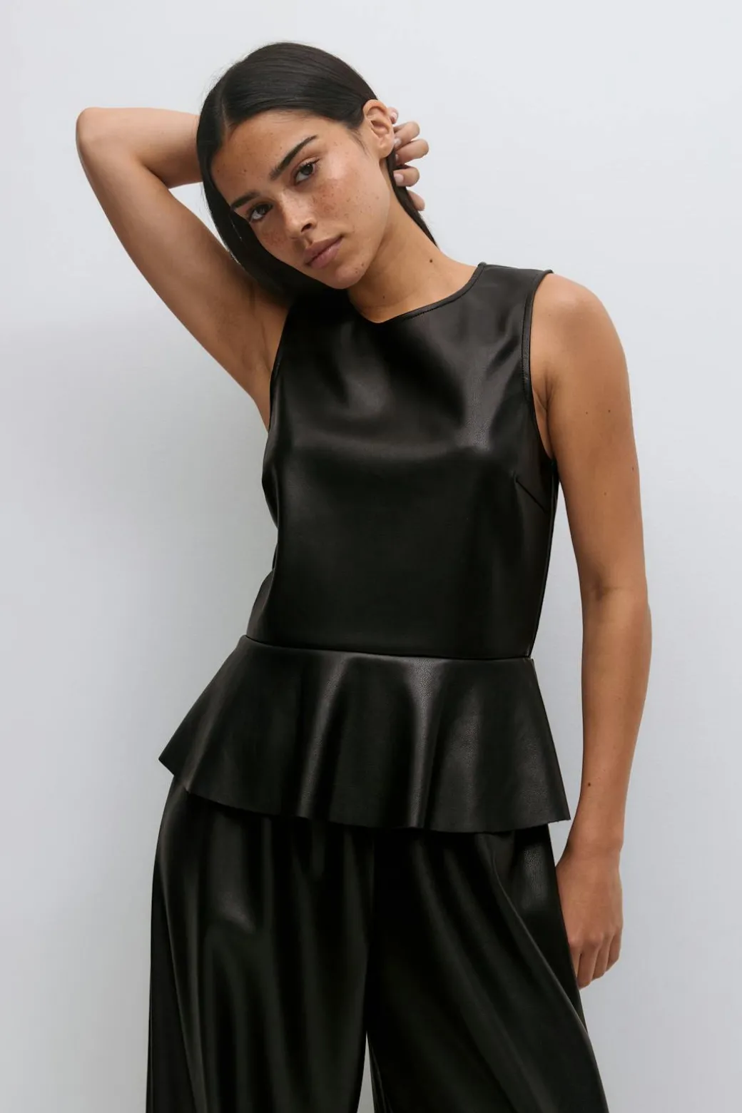 Pu peplum top