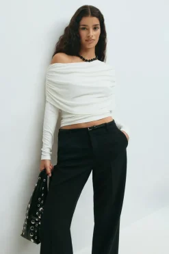 Sloped shoulder cape top
